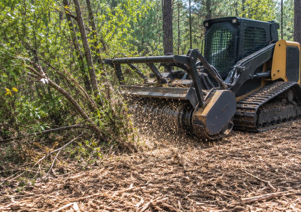 Forestry mulcher grinding brush into mulch